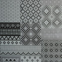 Toile cirée standard en 140 cm avec un patchwork de motifs divers