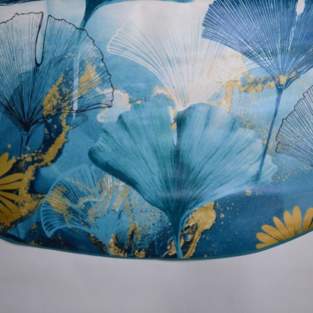 Toile cirée ronde, finie avec un biais de couleur, pour 4 à 6 couverts avec de larges feuilles bleu turquoise
