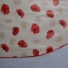 Toile cirée ronde pour 4 à 6 couverts, finie par un biais coloré avec des coquelicots sur fond beige