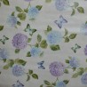 Toile cirée ronde, finie par un biais, pour 4 à 6 couverts, de jolis hortensias bleus et violacés