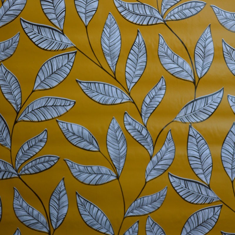 Toile cirée standard avec un motif de feuilles sur fond moutarde