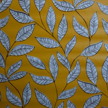 Toile cirée standard avec un motif de feuilles sur fond moutarde