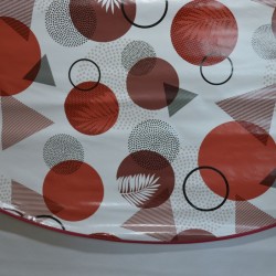 Toile cirée ronde Brigitte, finie par un biais, pour 4 à 6 couverts, avec des motifs géométriques rouges et anthracite