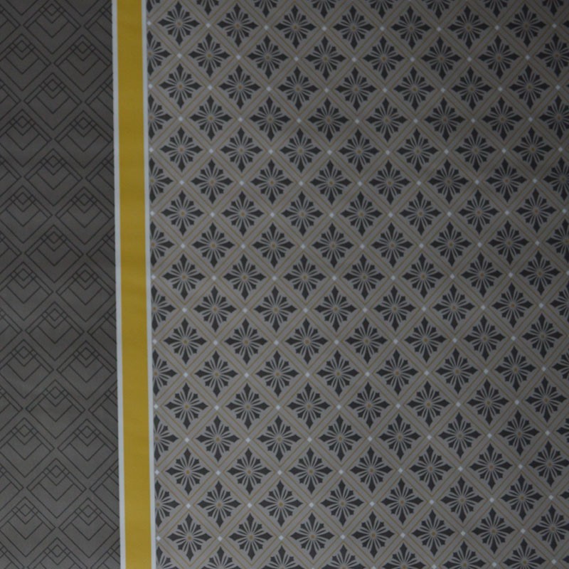 Toile cirée standard en 140 cm de large avec un mélange de motifs originaux et modernes