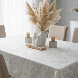 Toile cirée au mètre Enola, en 153 cm de large, motif de pissenlits stylisés en ton sur ton brillant, offrant un rendu raffiné