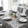 Tissu laminé au mètre Léane, au motif floral noir et blanc au style graphique