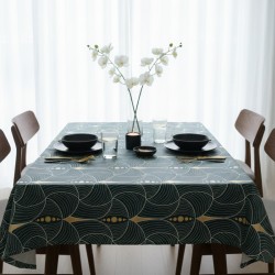 Toile cirée grande largeur au mètre Olympe, au motif art déco vert et or qui apporte une touche élégante et contemporaine