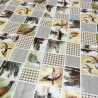 Toile cirée au mètre Léon, un patchwork champêtre mêlant oiseaux et motifs à carreaux beige...