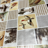 Toile cirée au mètre Léon, un patchwork champêtre mêlant oiseaux et motifs à carreaux beige...