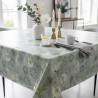 Toile cirée au mètre Nerina, en 160 cm de large, ornée de magnifiques fleurs aquatiques pour sublimer votre table...