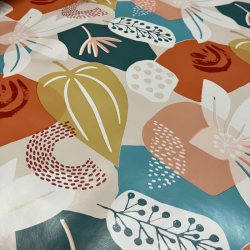 Toile cirée au mètre Sienna, en 160 cm de large, un motif floral graphique aux tons terracotta, ocre et vert