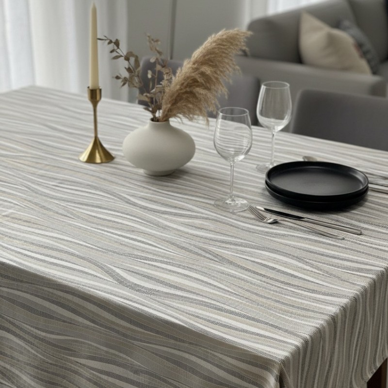 Toile cirée au mètre Ondine, en 180 cm de largeur, motif graphique aux lignes ondulées dans des tons neutres