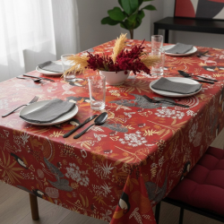 Toile cirée au mètre Anjali rouge, un motif vivant et exotique, des toucans colorés et des feuillages tropicaux