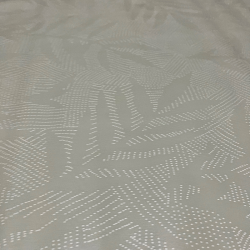 Toile cirée au mètre Silva écru, en 180 cm de largeur, un motif végétal graphique