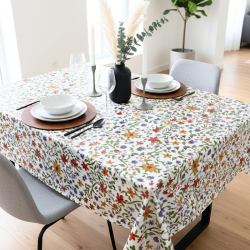 Toile cirée au mètre Renée, motif de fleurs sauvages avec des touches de rouge, jaune et violet viennent illuminer l'ensemble