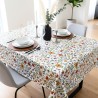 Toile cirée au mètre Renée, motif de fleurs sauvages avec des touches de rouge, jaune et violet viennent illuminer l'ensemble