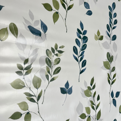 un motif orné de branches de feuilles dans des tons vert olive, de bleu vert et de gris