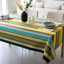 Tissu enduit au mètre Camélia, un bayadère multicolores mêlant jaune, terracotta et vert canard...