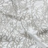 Tissu enduit de Savoie, un élégant motif de coraux gris clair sur fond écru